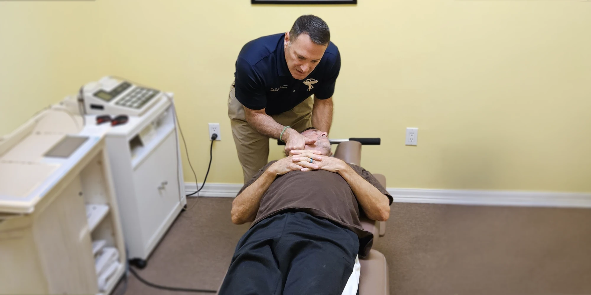 Dr. Caruso performing a chiropractic neck adjustment